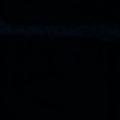 Male hand on dark background showing drawn light bulb