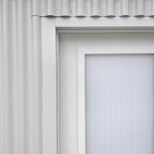 Eightyseven 87 architecture - soft grey cladding and door detail