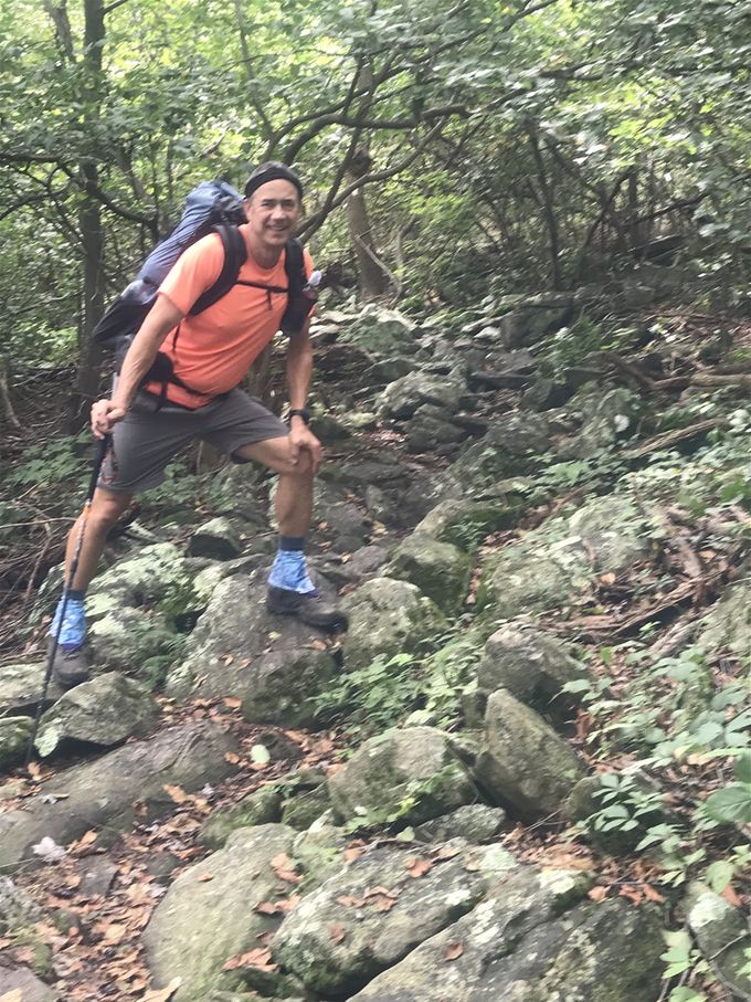 MacGyver leaning into those rocks!