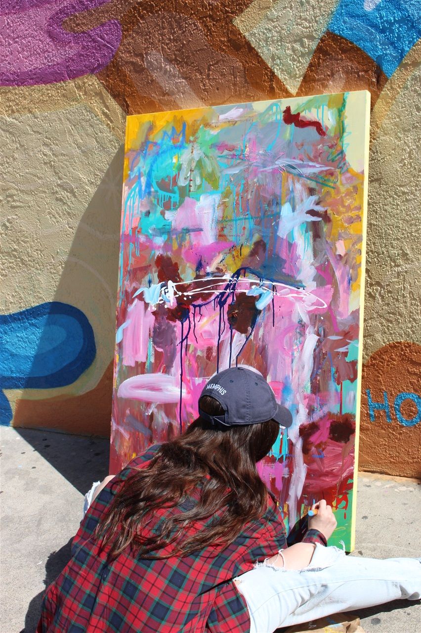 Signing a piece that hangs in North Park, San Diego, California