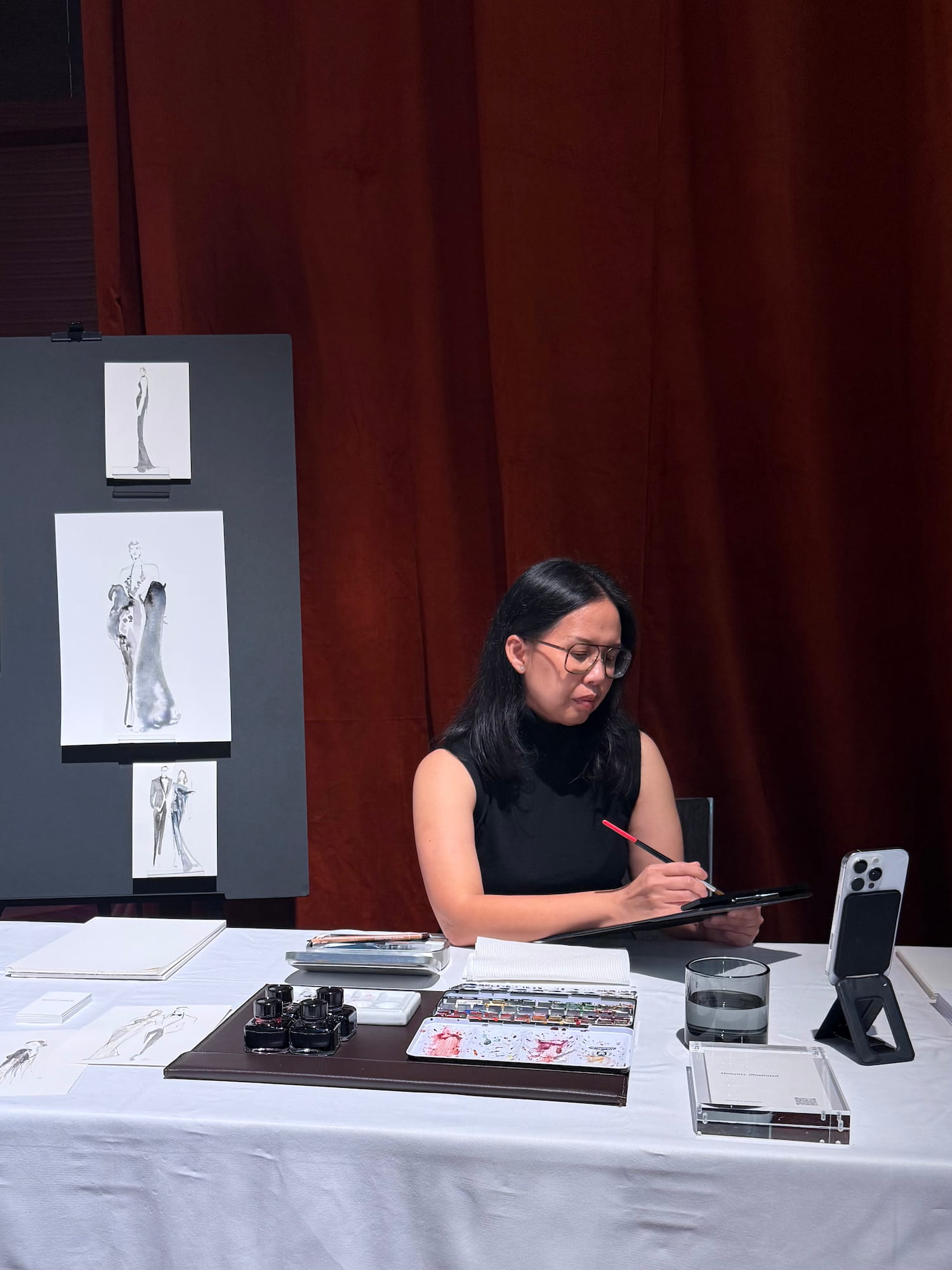 Anastasia Tanuputri creating live fashion illustrations at the Hilton Sydney Wedding Showcase