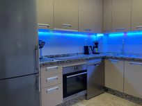 Kitchen, to the left of the hallway