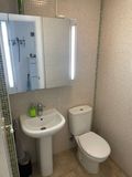 WC, to the left of the hallway