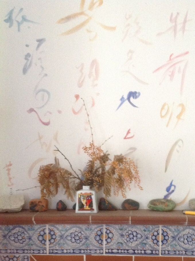 my fireplace with Li Po poem Quiet night in Chinese calligraphy
rocks painted with childhood memory lie between Picasso vase and tea pots. A pomelo lantern was remade to recall the prop realised by Director Ng Wui, during the theatre practices over the many weekends in 1972