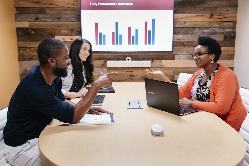 early perfomance indicators black people in conference meeting