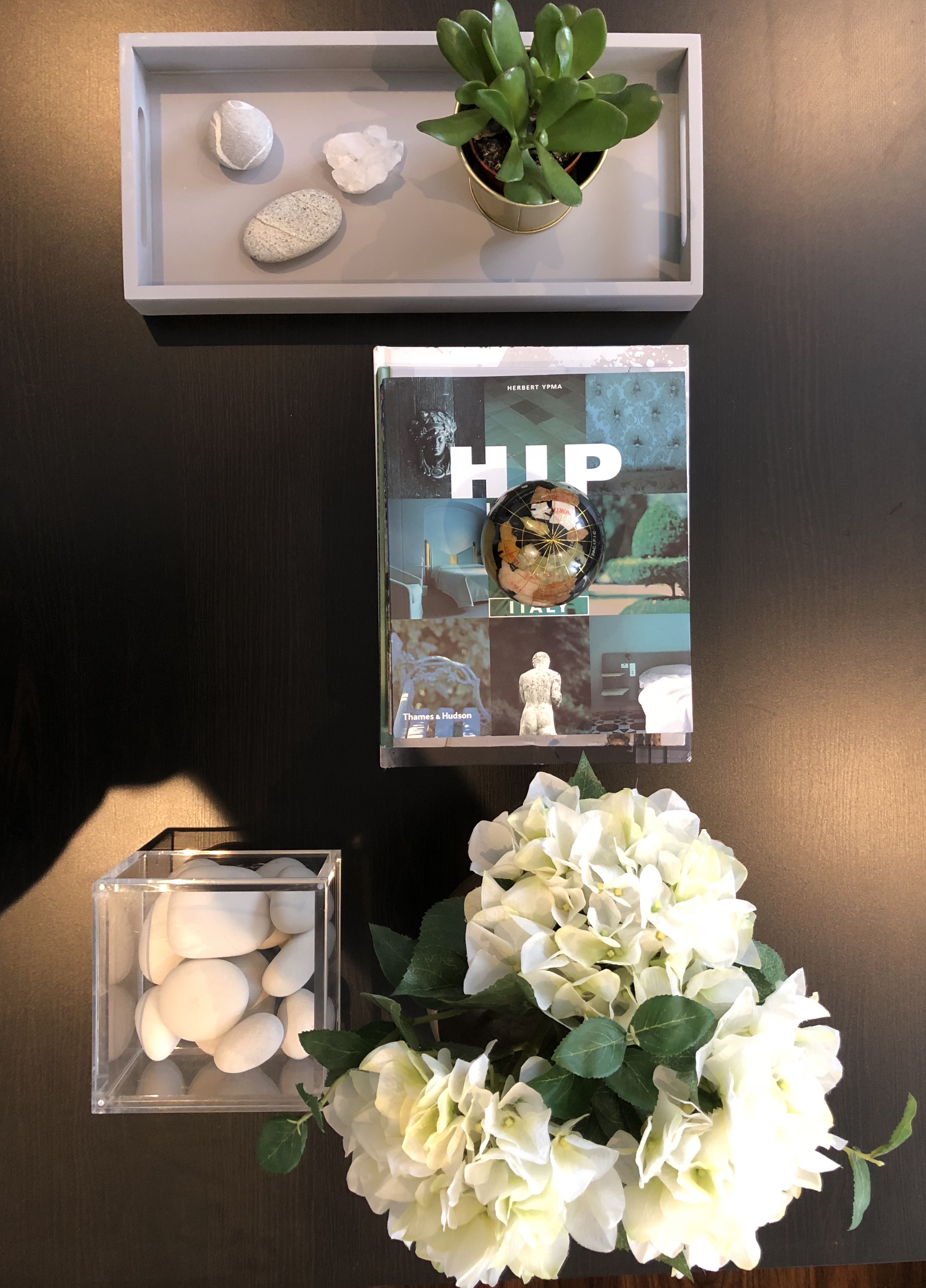 Coffee table display, flowers, pebbles and Hip Hotels