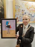Carin Myrberg at Falun Gong exhibition with painting of Armand Duboix