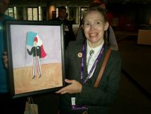 Carin Myrberg with painting of Armand Duboix