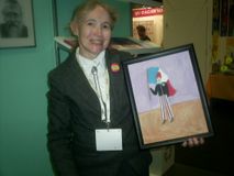 Carin Myrberg with her painting of Armand Duboix