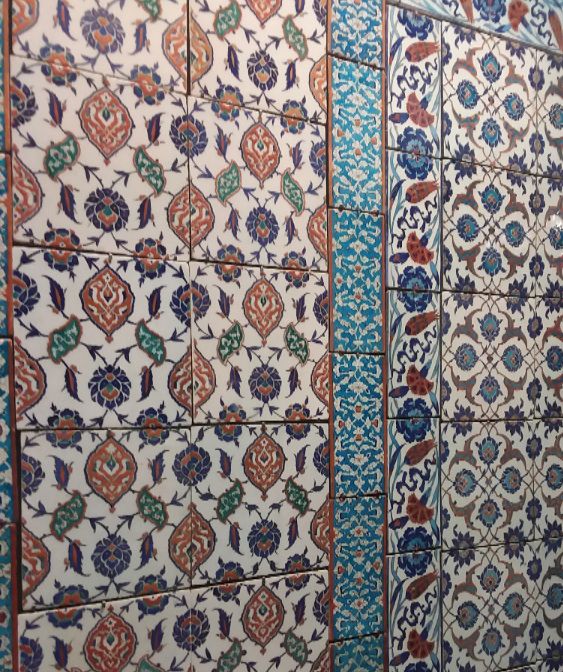 This is Islamic tile art which is part of the collection in the Islamic and pre-Islamic room in the Louvre museum.