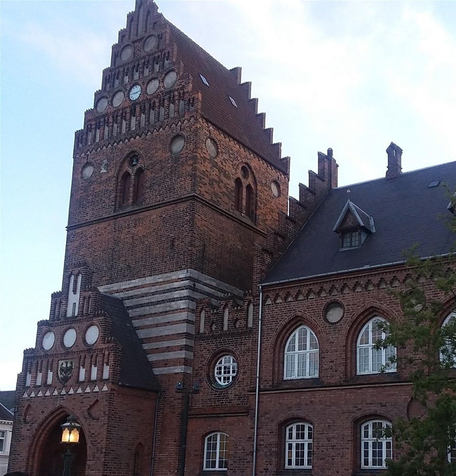 We are in the area of Rosgilde Cathedral and the Royal Mansion in Roskilde Danmark. This particular building was the City Hall in medieval times. There is now a Skt.  Laurentius History Museum here. getting ready to walk from here to the Viking Museum which is not far at all.