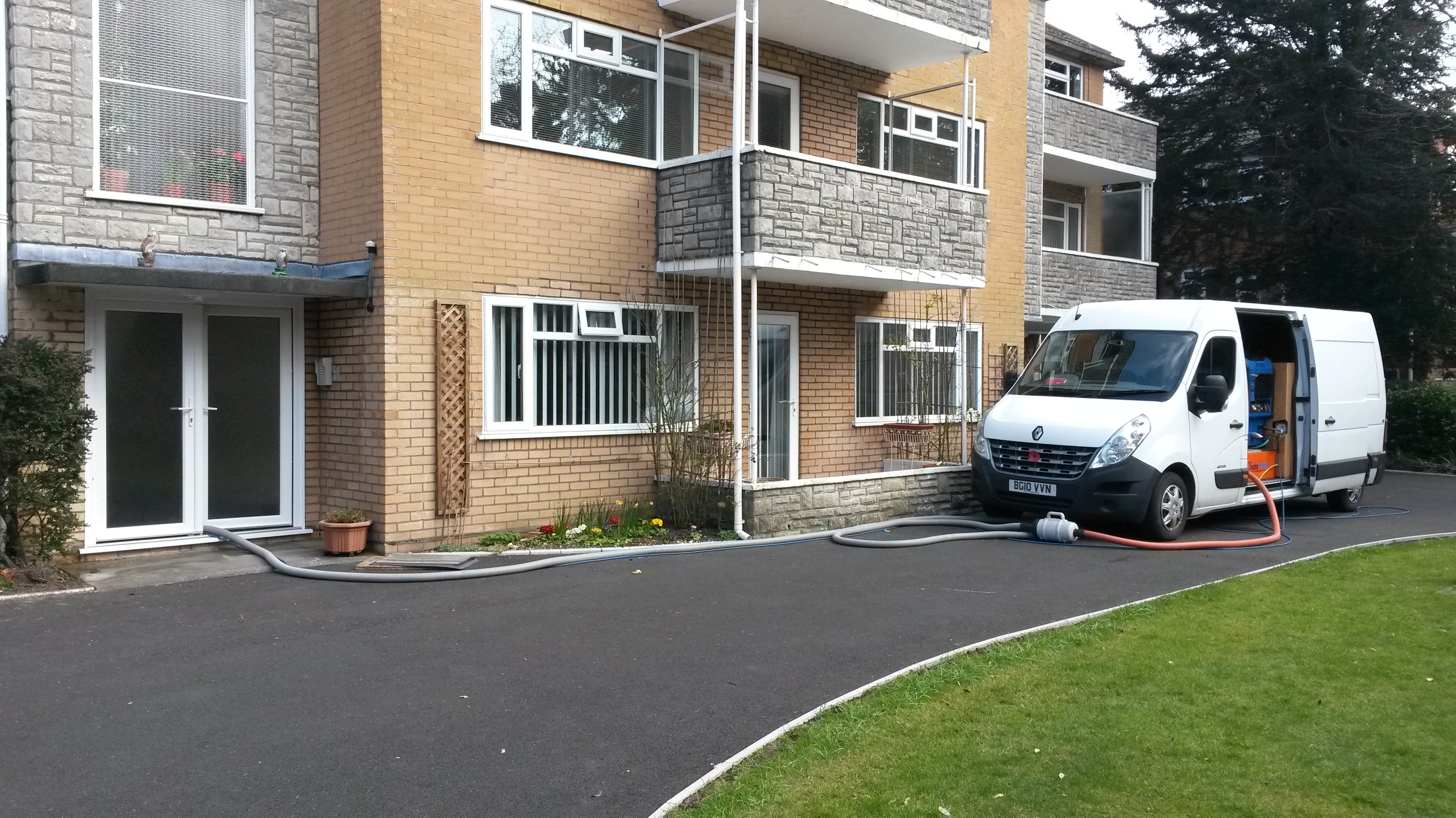 Our Truckmount cleaning machine outside a block of flats cleaning the comunal areas of carpeting link to commercial carpet cleaning