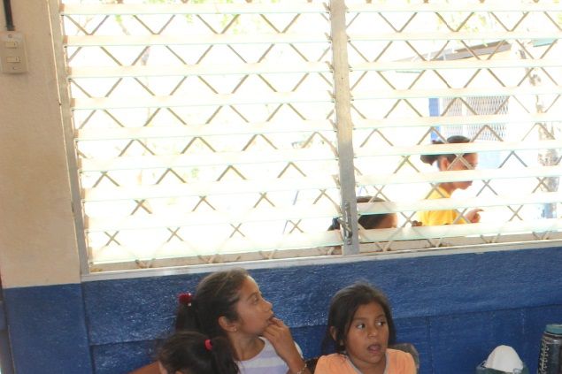 Sharing our Gallo Pinto and peanut butter sandwiches with the children
