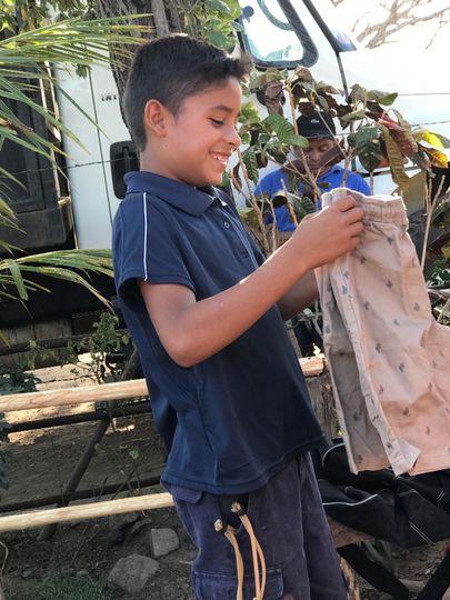 Orlando loving his new clothes from his sponsor family