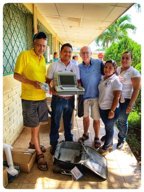 Gifting the ECG machine. Pictured here are Doug Thompson- co-founder and leader of COMMIT and team member Mike Rosser with Nandaime hospital staff. 