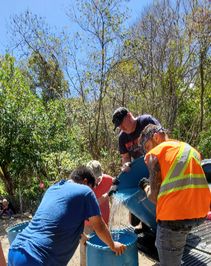 Everyday water must be filled into the large barrels at the well and then poured into different barrels at the job side. 