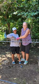 Kim and Raquel  tying rebar 