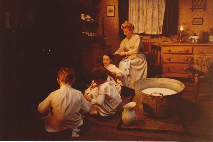 The actors in the kitchen preparing for bath!