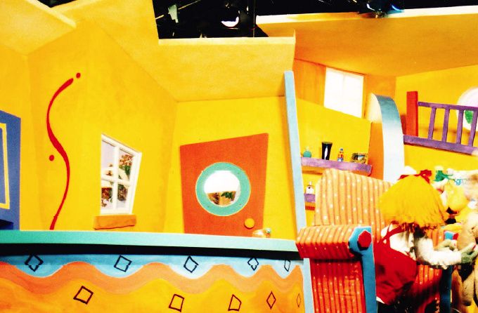 The inside of our colourful house. Francis Wright (puppeteer) in action