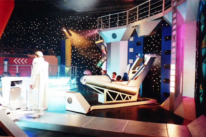 One of the Team's rocket game rides emerges from the side doors.
Each rocket contained an individual game console that was reproduced on the video wall for the audience to see their progress.
