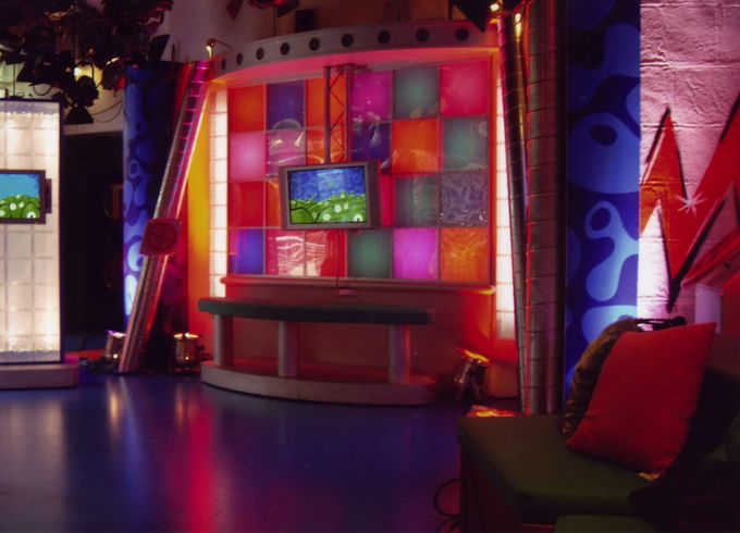 A sort of presenter perch bench mosaic wall