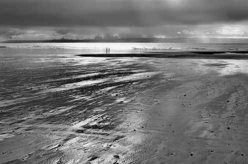 Wet Sand and Dark Clouds