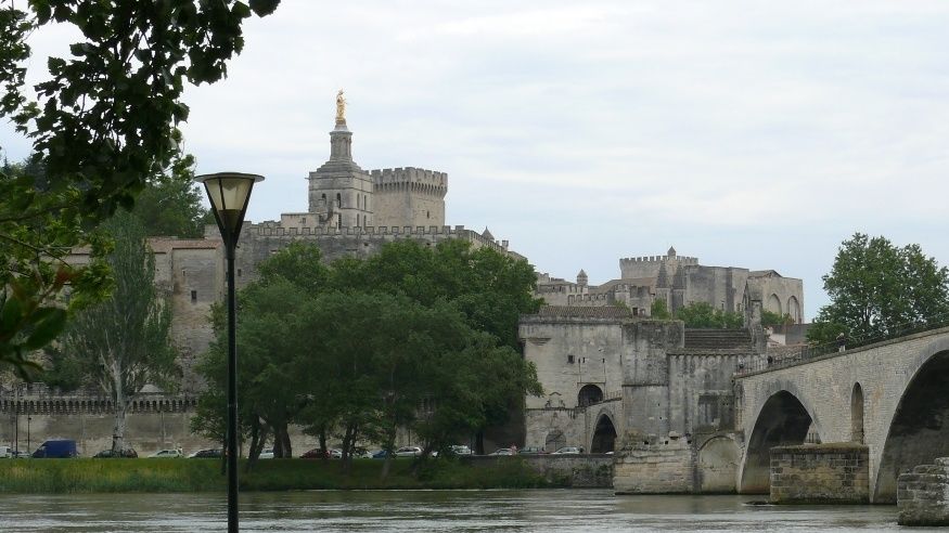 The bridge at Avignon from the opposite bank with the Palace of the Popes in the background