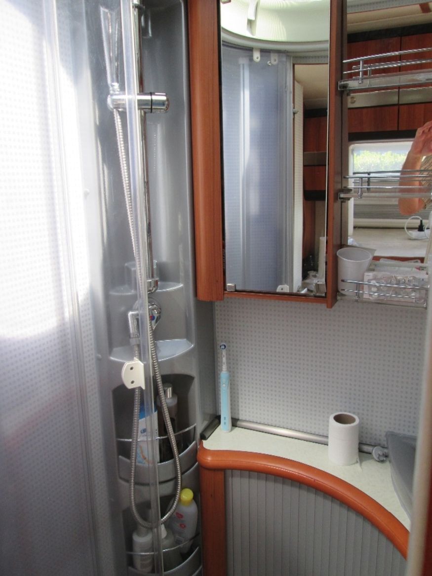 The shower within the bathroom compartment. All very compact, all very effective.