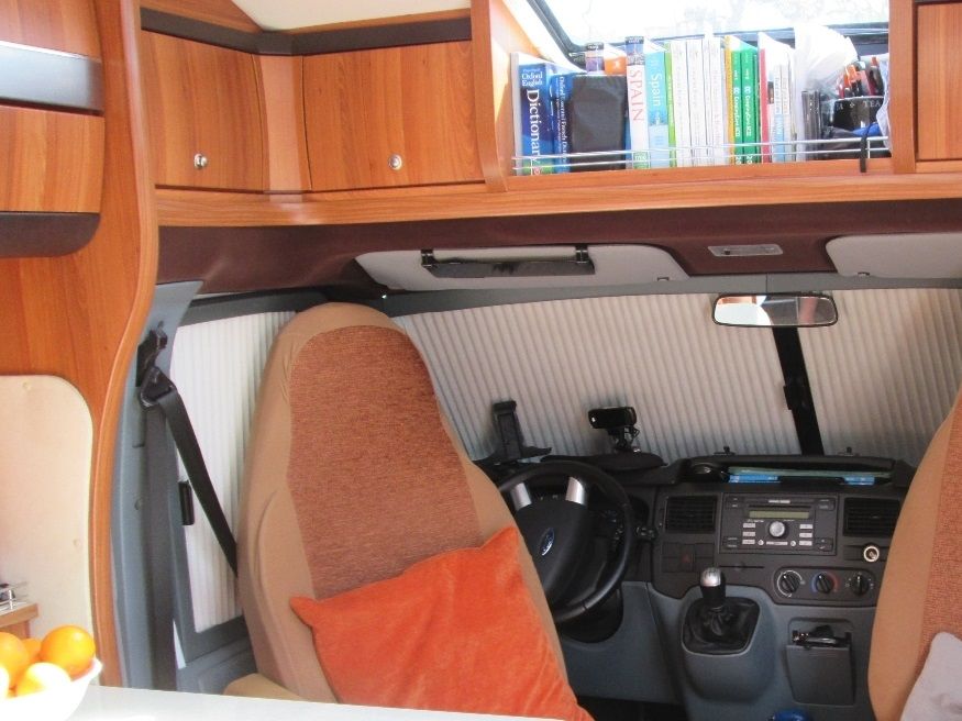The two cab seats spin round to form part of the lounge/dining area. Both have seat covers on them which match pretty well.