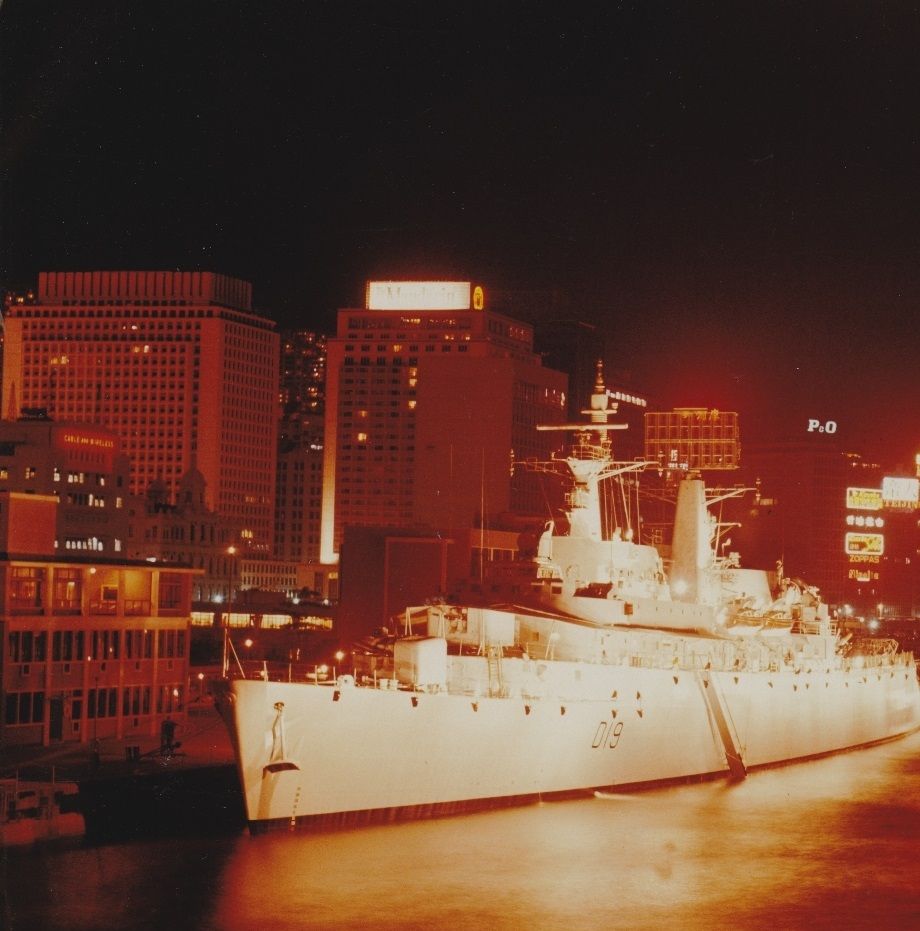 HMS Glamorgan, our destroyer escort parked behind us in Hong Kong harbour, late 1968