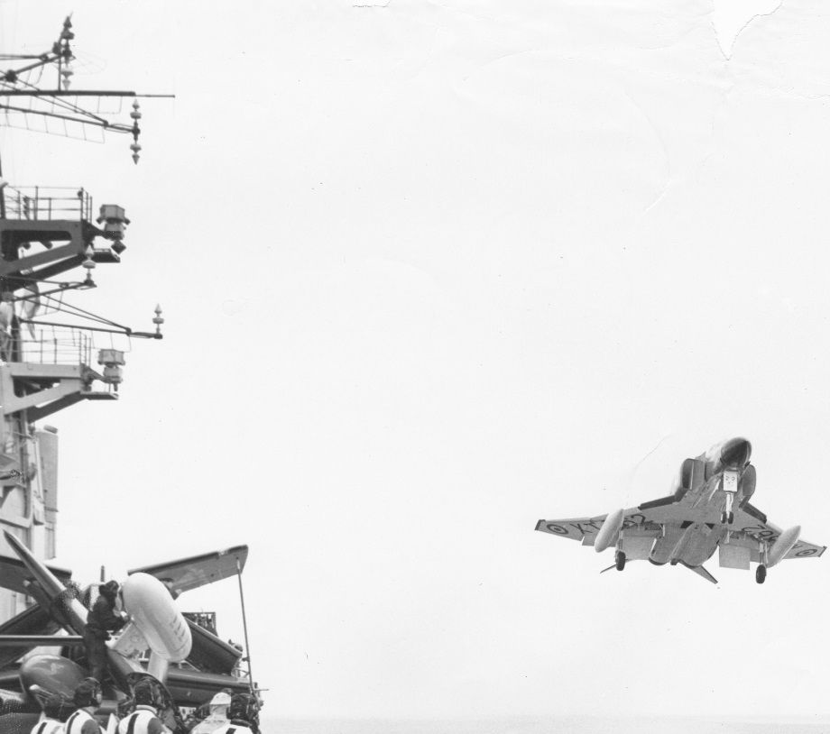 In the Western Approaches Phantom jets due to serve on HMS Ark Royal practice deck landing approaches on HMS Hermes.