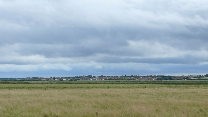 Wells is in the distance