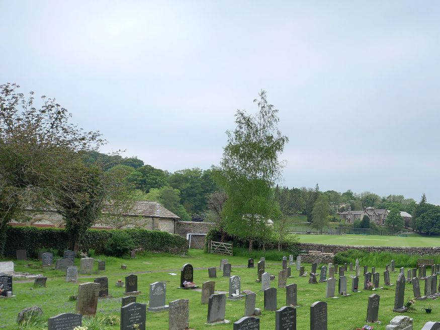 Giggleswick cemetery with Giggleswick school in the distance.