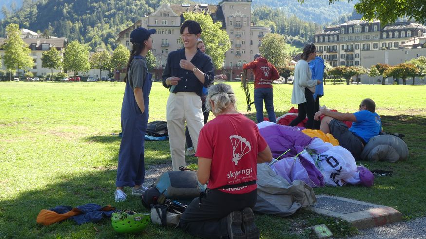 The Asian girl on the left had just landed strapped to the guy in red.