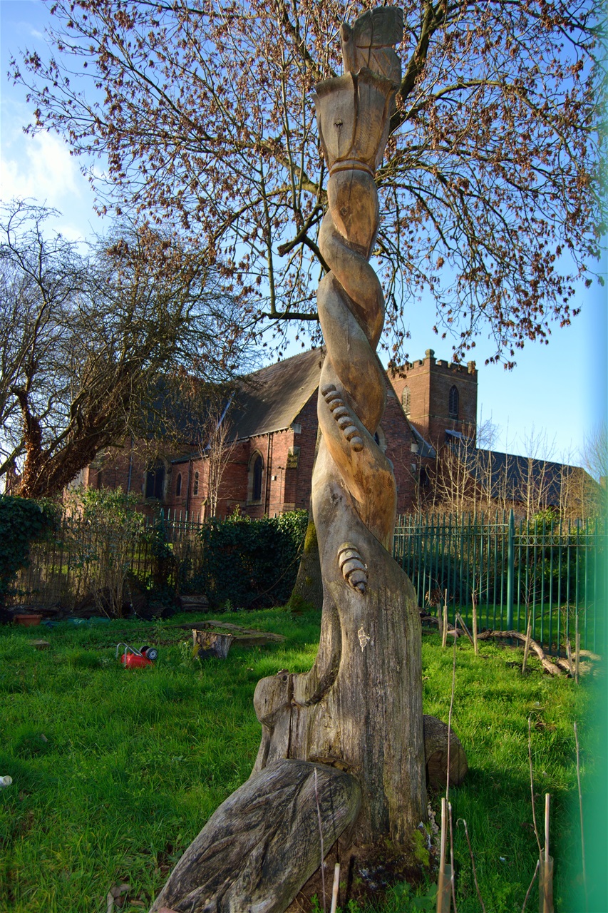 Wooden totem pole in small park behind Church. Jan 2020 noticed it was missing