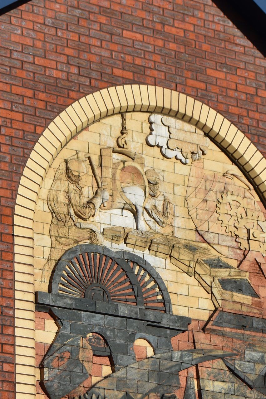 High st, above Job centre. Industrial Images sculpted by John McKenna