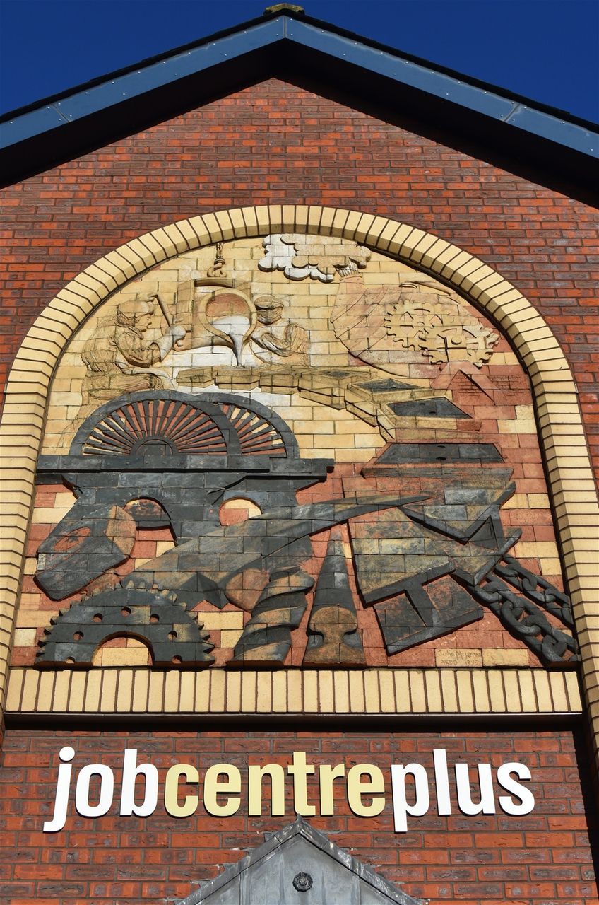 High st, above Job centre. Industrial Images sculpted by John McKenna