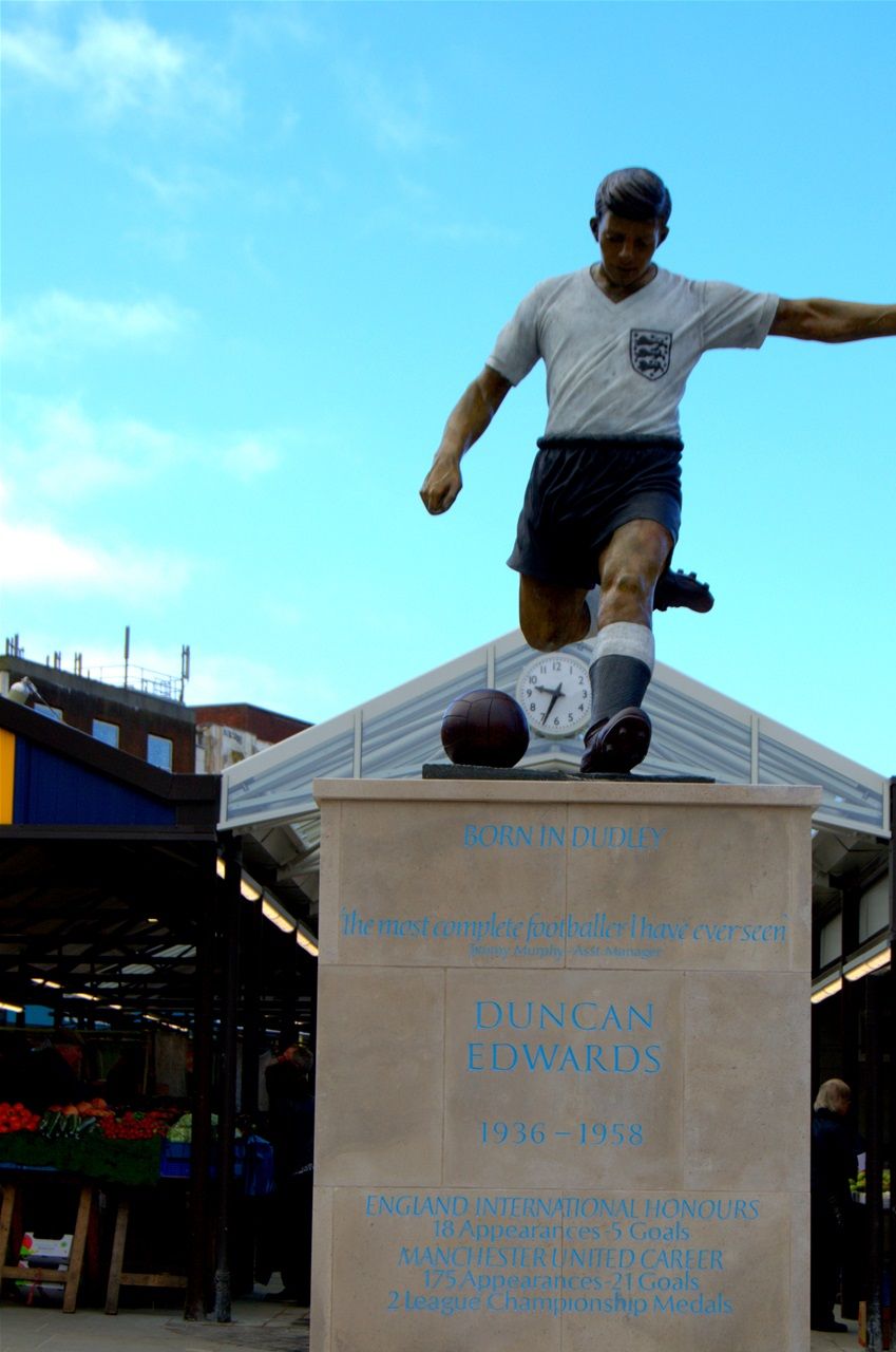 Market place, Duncan Edwards, designed by James Butler in bronze, patinated. Mike Davis Foundry. Plinth designed by Steve Field, inscribed by Malcom Sier