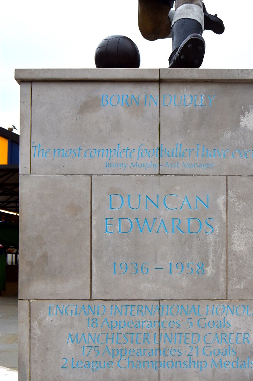 Market place, Duncan Edwards, designed by James Butler in bronze, patinated. Mike Davis Foundry. Plinth designed by Steve Field, inscribed by Malcom Sier