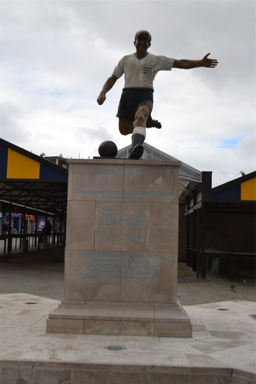 Market place, Duncan Edwards, designed by James Butler in bronze, patinated. Mike Davis Foundry. Plinth designed by Steve Field, inscribed by Malcom Sier