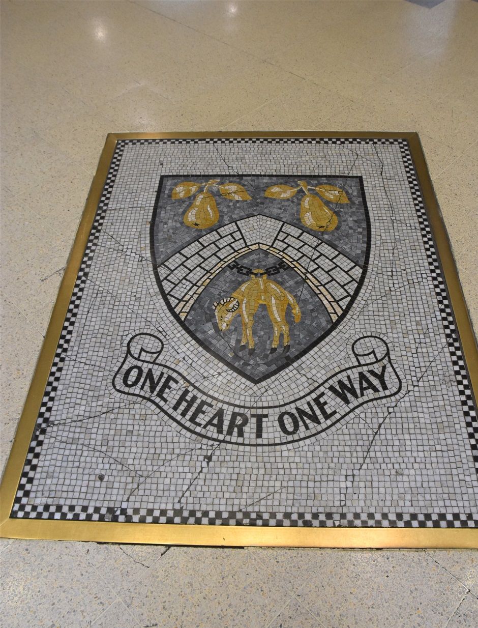 Borough arms cut into the floor of the Crown Centre