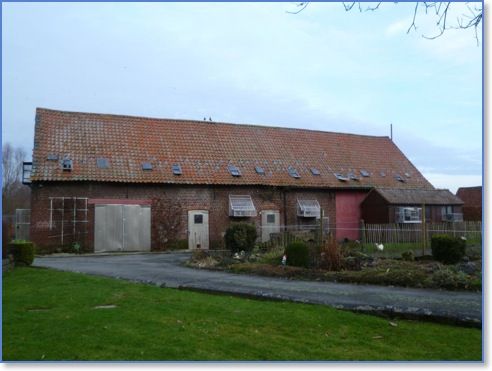 A view of the old barn with on the right a garden loft.