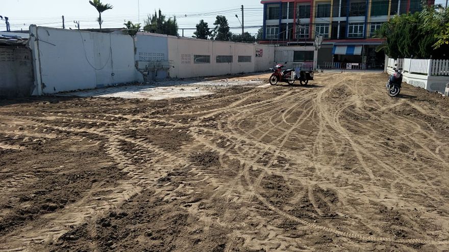 # 11 In the former place where the old building once stood, we now only see a motorcycle, an old wall and of course the worked ground that becomes part of the foundation. In connection with the construction, we have also raised the ground to cope with floods better when the monsoon rains hit.