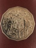 The reverse of the coin on the left 