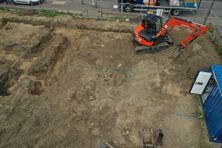 Aerial image of a digger at a construction site