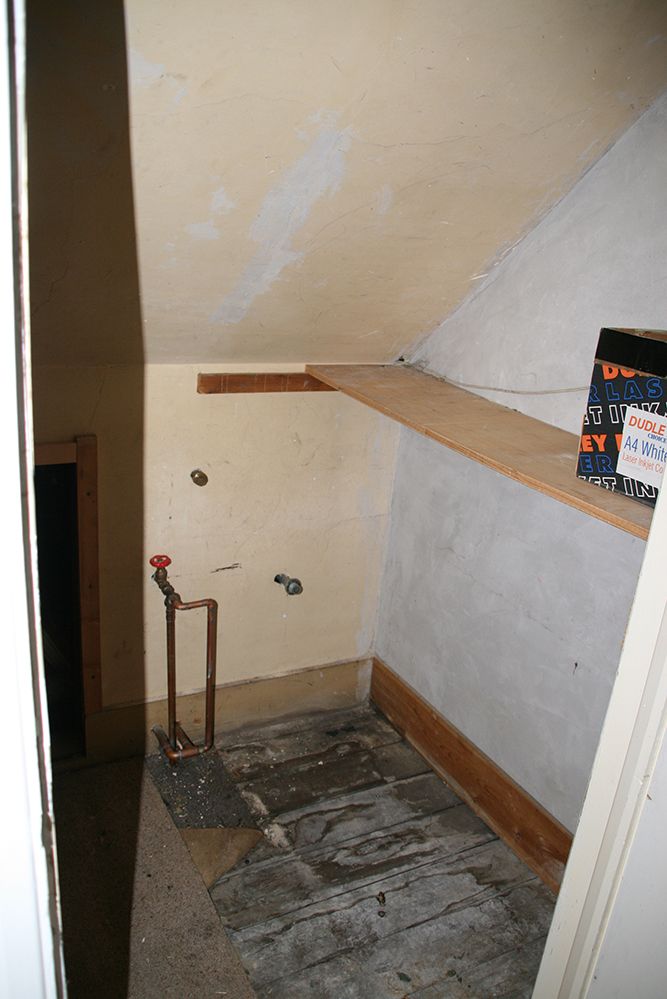 a new storage space where the cold water tank used to be