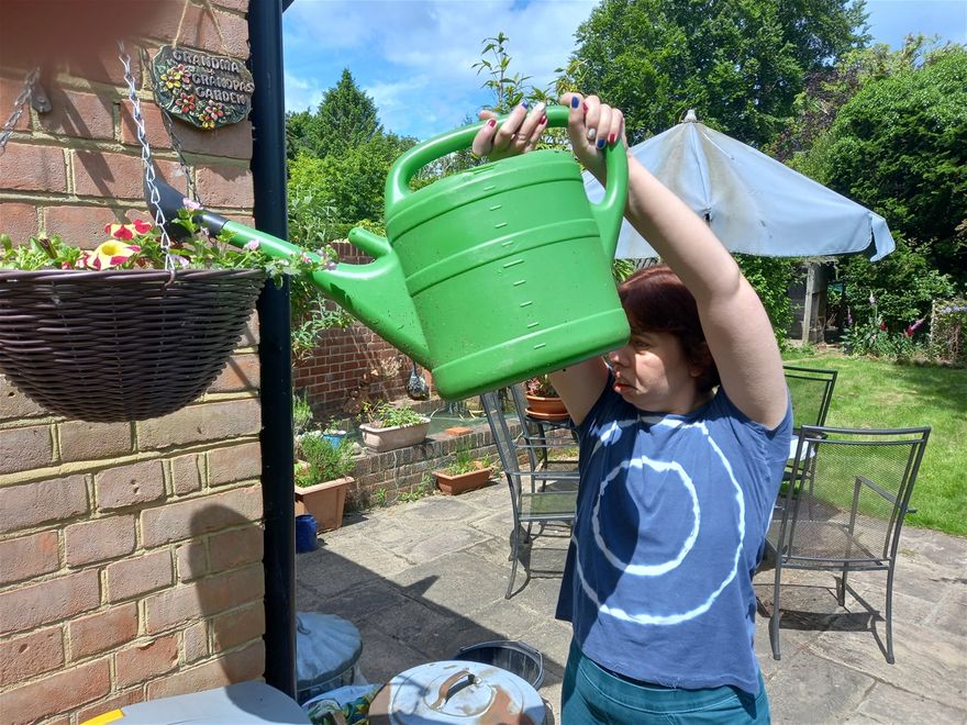 watering the baskets