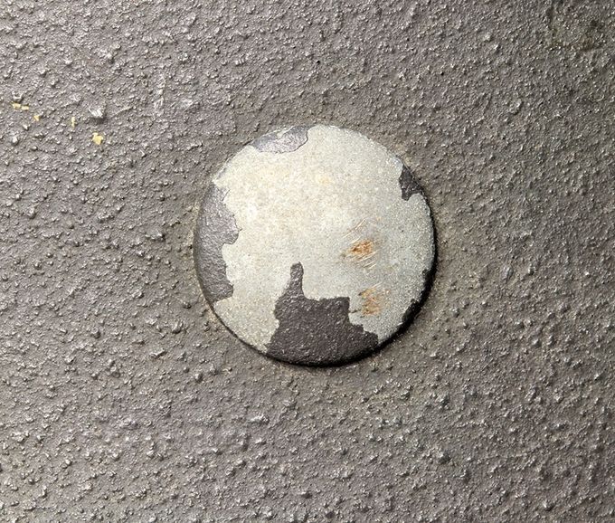 Steel rivet with zinc coating on an M42. Note the textured paint around the head.