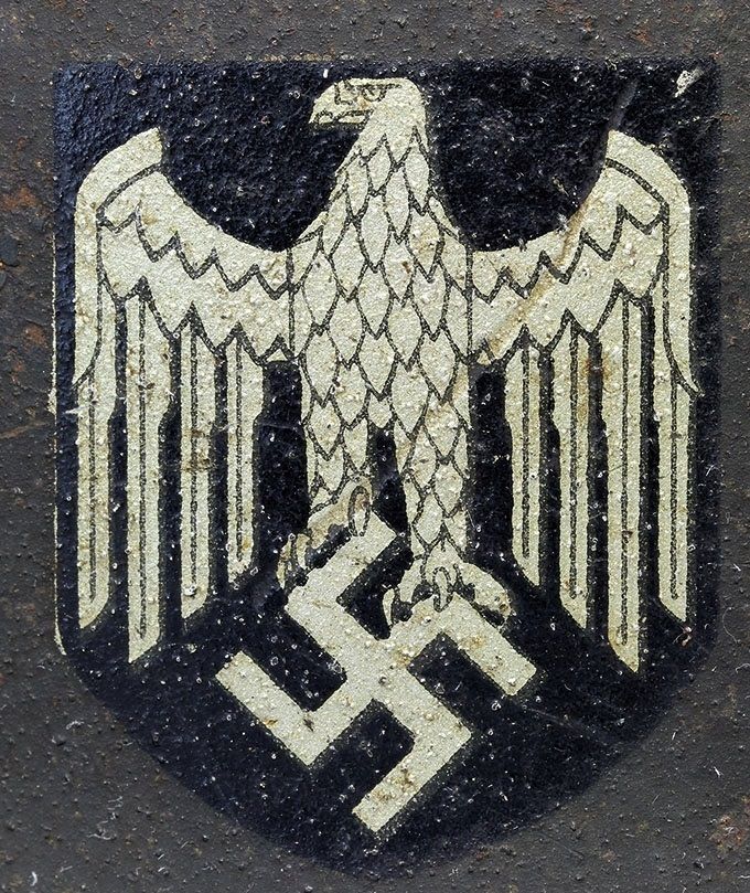 ET decal from an M42. Note the backing of the decal (visible on the left edge) that has the same silver color as the eagle itself.