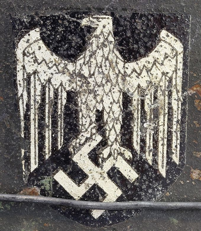 C.A. Pocher decal on an M40 NS. This helmet has been fitted with wire for camouflage purposes. 